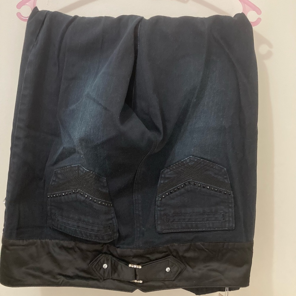 Black pants with rhinestones design.